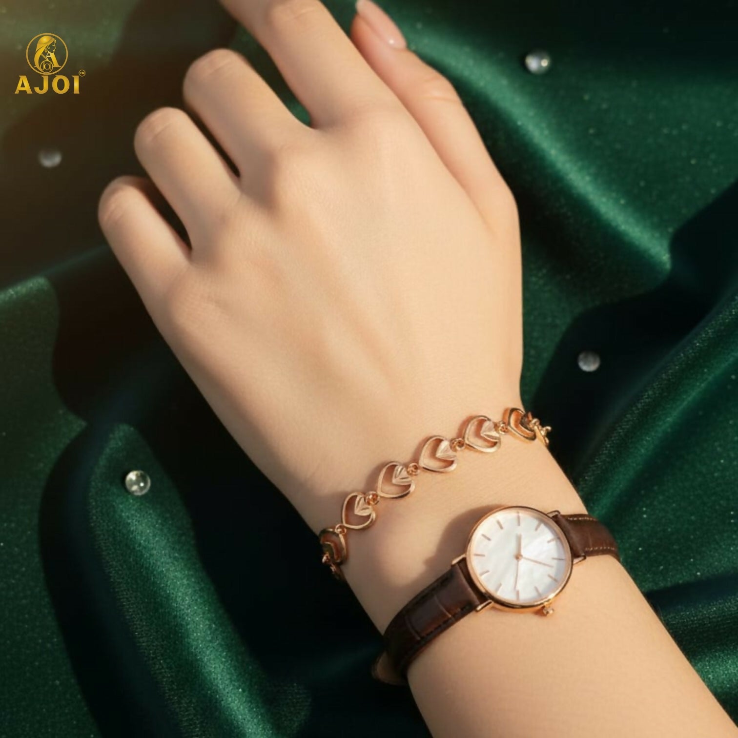 Gold plated heart link bracelet with adjustable clasp displayed on a white background
