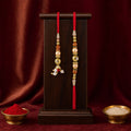 Couple Rakhi Hanging Pair with Pearl Drops, Gold Accents and Beaded Layers