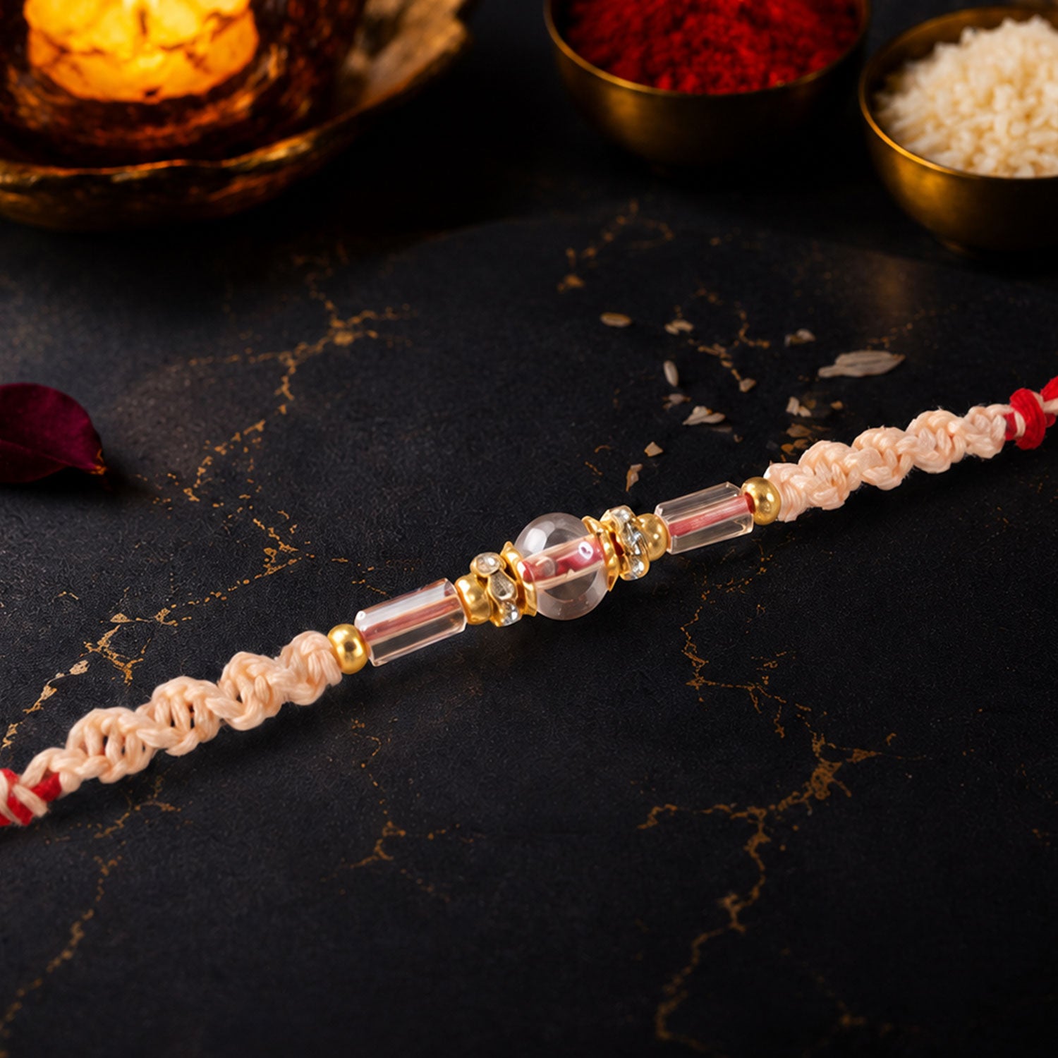 Sparkling Pearl Stone Rakhi with Colorful Thread and Premium Festive Beauty