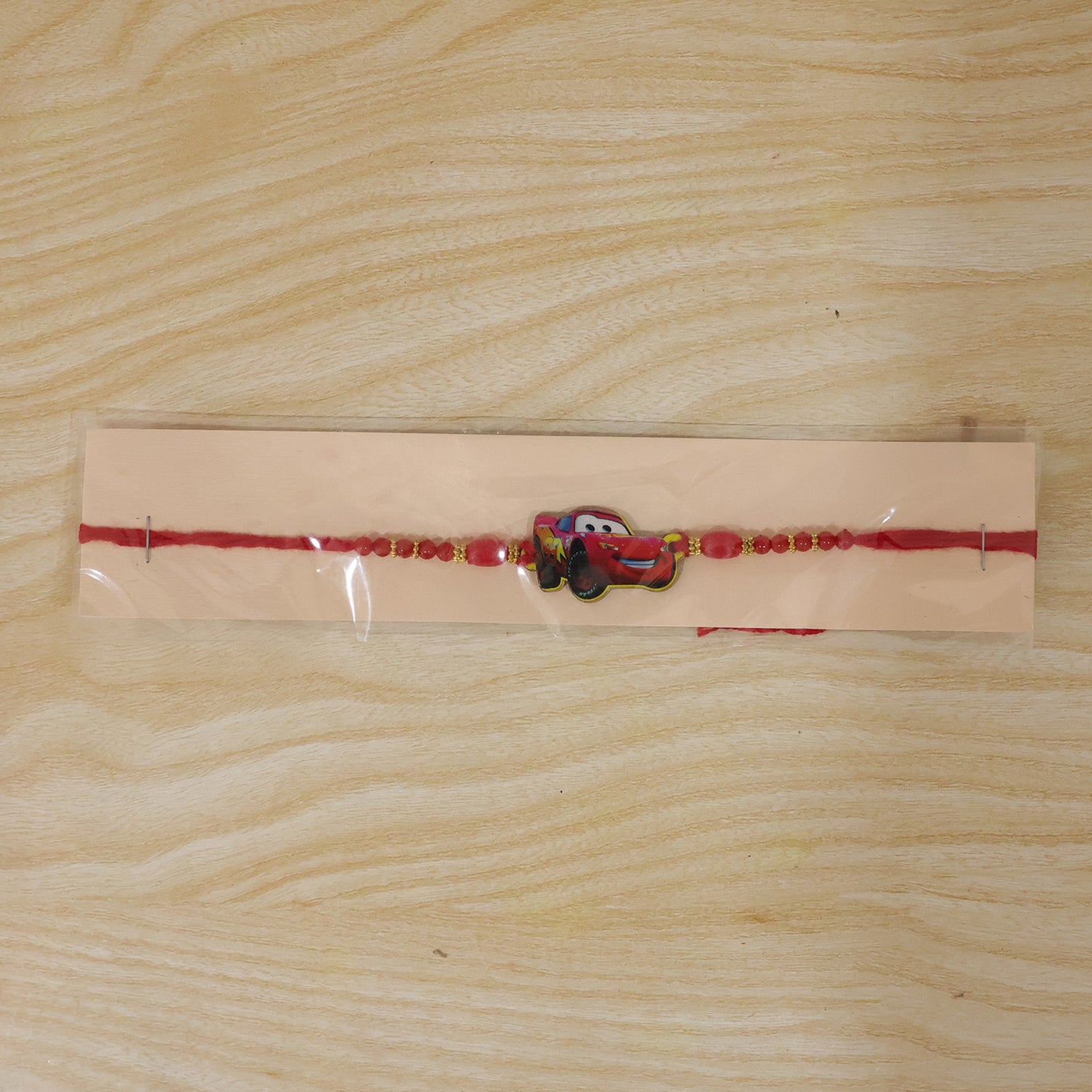 Red Racing Car Kids Rakhi with Gold Beads and Red Thread