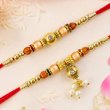 Bhai Bhabhi Kundan Rakhi Set with Red Thread, Gold Beads and Pearl Drop Accent Design