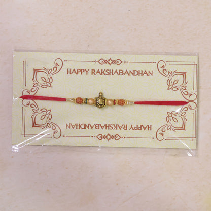 Red Thread Rakhi with Antique Gold Turtle Pendant and Beaded Accents