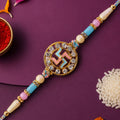 Divine Rakhi showcasing Swastik Circle Plaque, gold trims and chain look for Gift Use