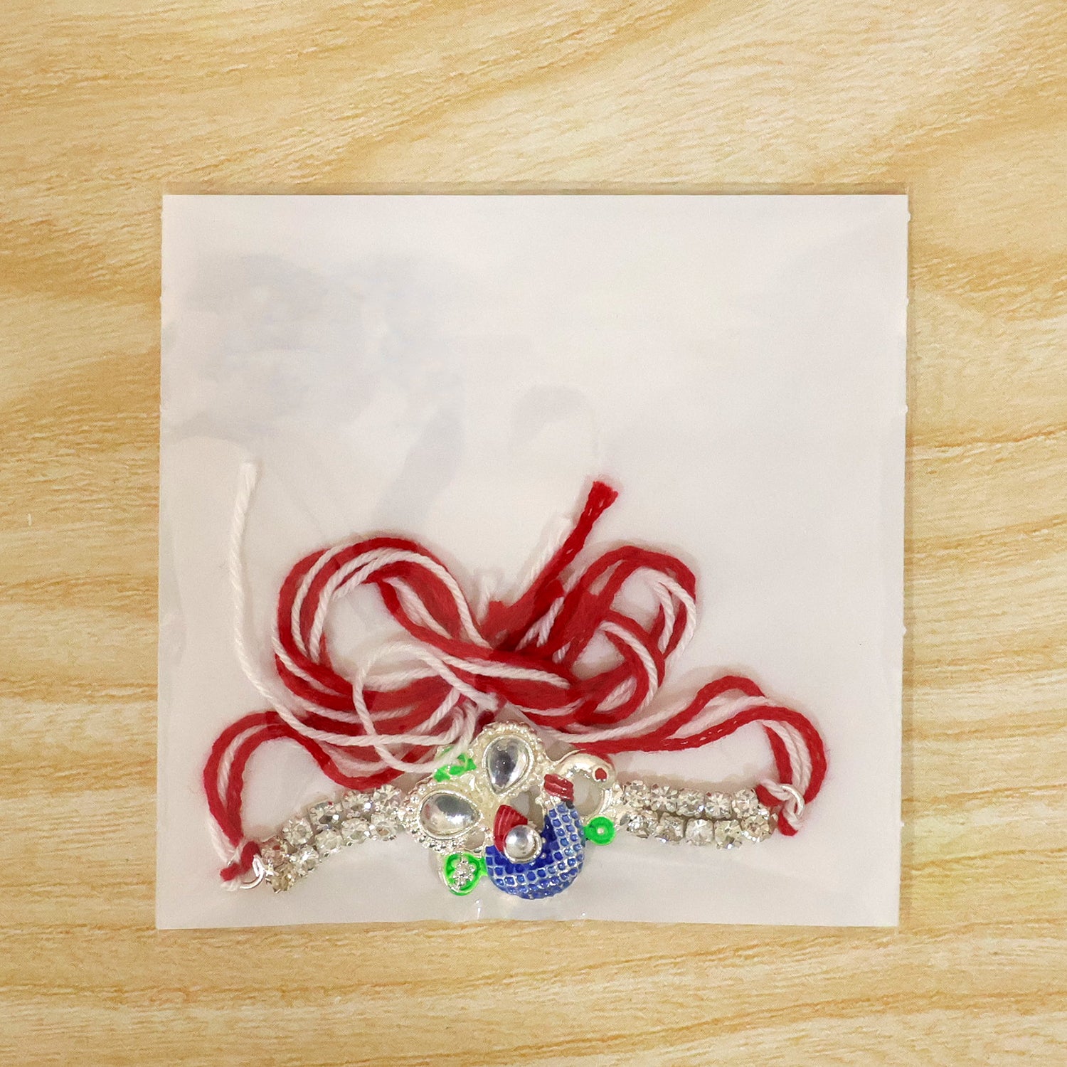 Premium Rakhi with Leaf Floral Charm, crystal accents and display look for Gift Use