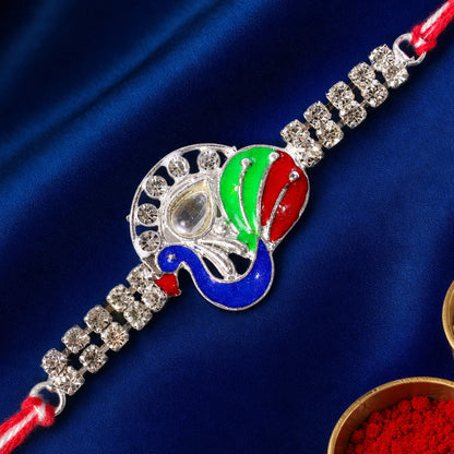 Silver-Toned Peacock Rakhi with Multicolor Enamel, Kundan-Style Stone & Double Crystal Chain