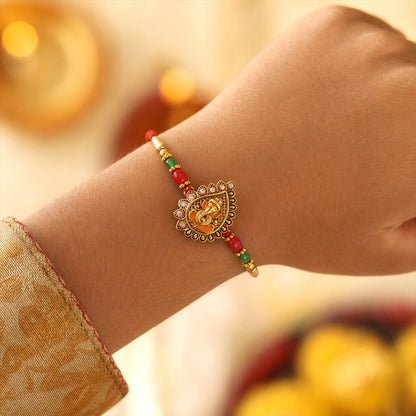 Antique Golden Ganesha Rakhi with Red & Green Beads and Crystals (5pcs)