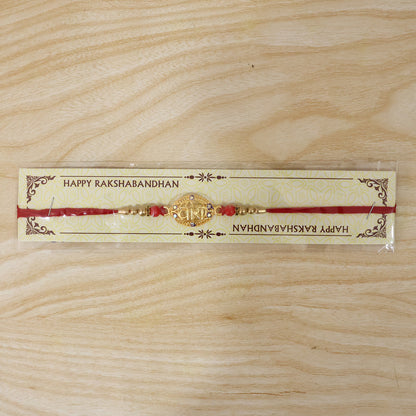 Golden Veera Rakhi for Boys with Red Beads and Thread