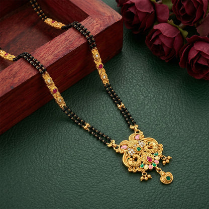 Detailed view of Makara dragon motifs and teardrop stone on mangalsutra pendant