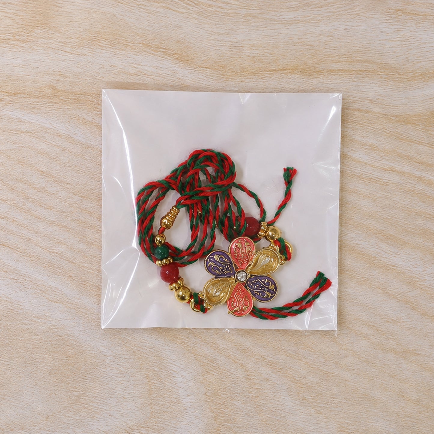Colorful Floral Rakhi with Red Green Beads and Traditional Festive Gifting Elegance