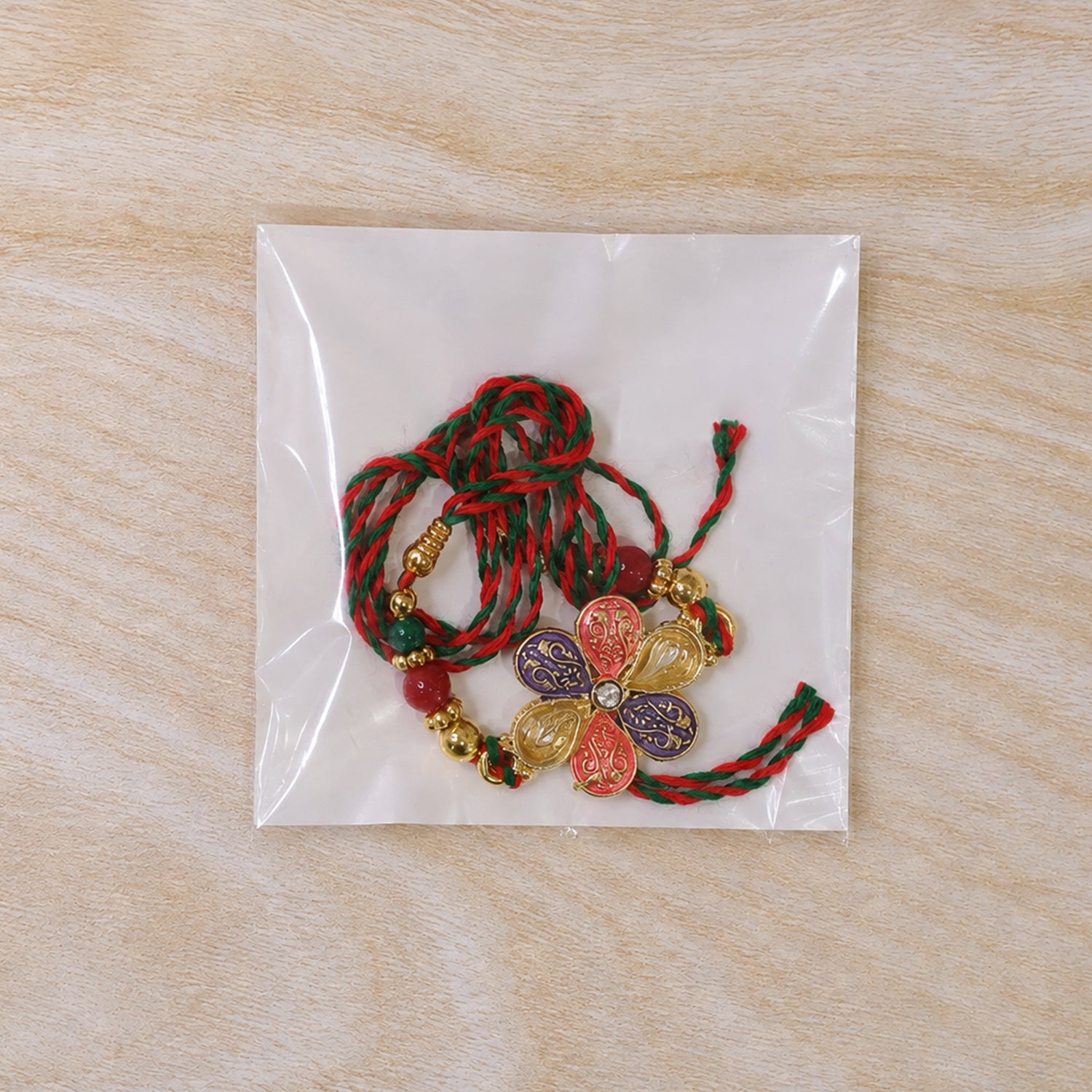 Colorful Floral Rakhi with Red Green Beads and Traditional Festive Gifting Elegance