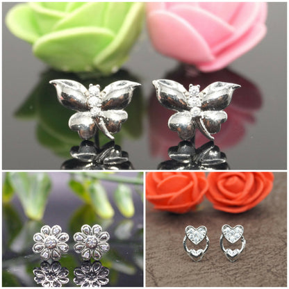 Silver stud earrings set with butterfly, flower, and heart designs featuring gold plating and cubic zirconia