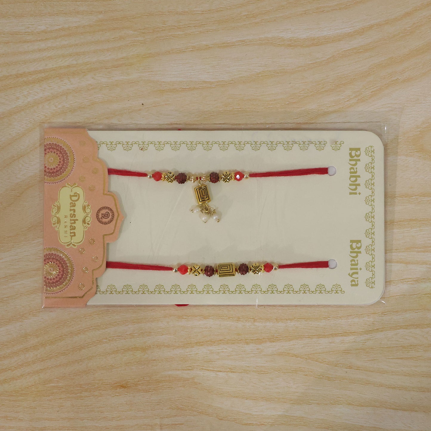 Rudraksha Geometric Rakhi Set with Pearl Lumba Charm for Festive Couple Gift Giving
