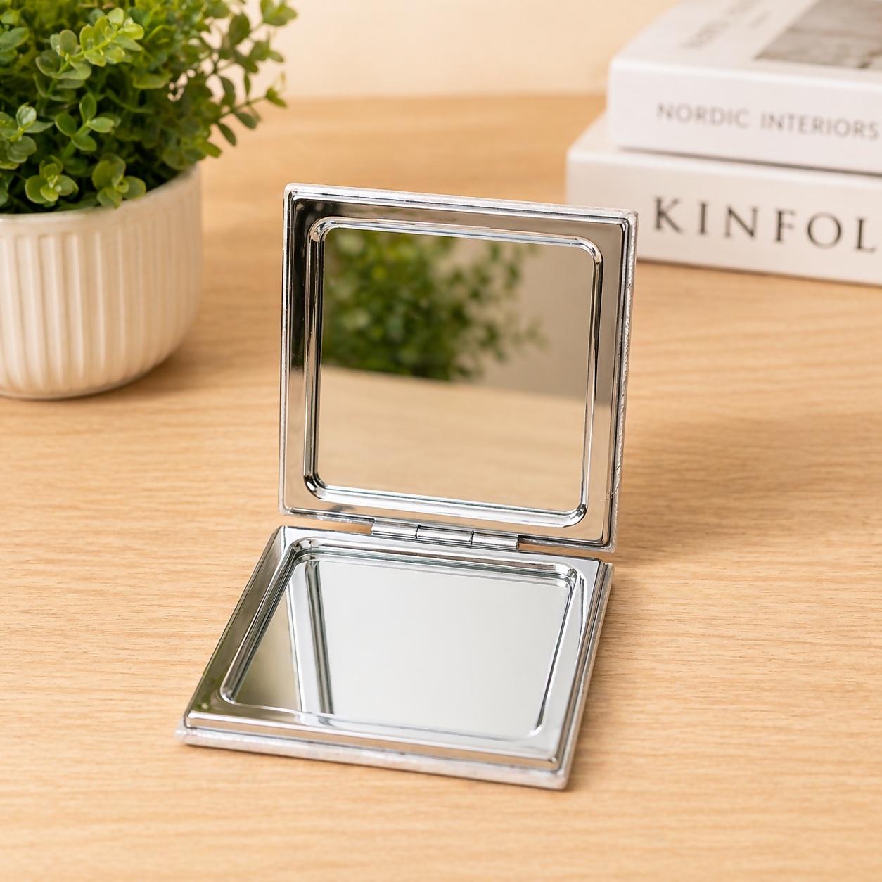 Durable hinge detail on folding pocket makeup mirror