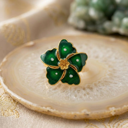 Green floral statement ring for women with glossy enamel and gold-tone details.