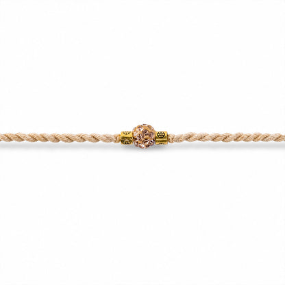 Cream Cord Rakhi with a Sparkling Floral Crystal Stone Pendant