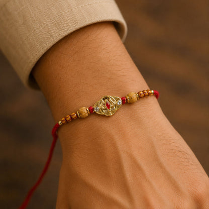 Tilak Trishul Golden Devotional Rakhi with Wooden Beads and Traditional Red Thread