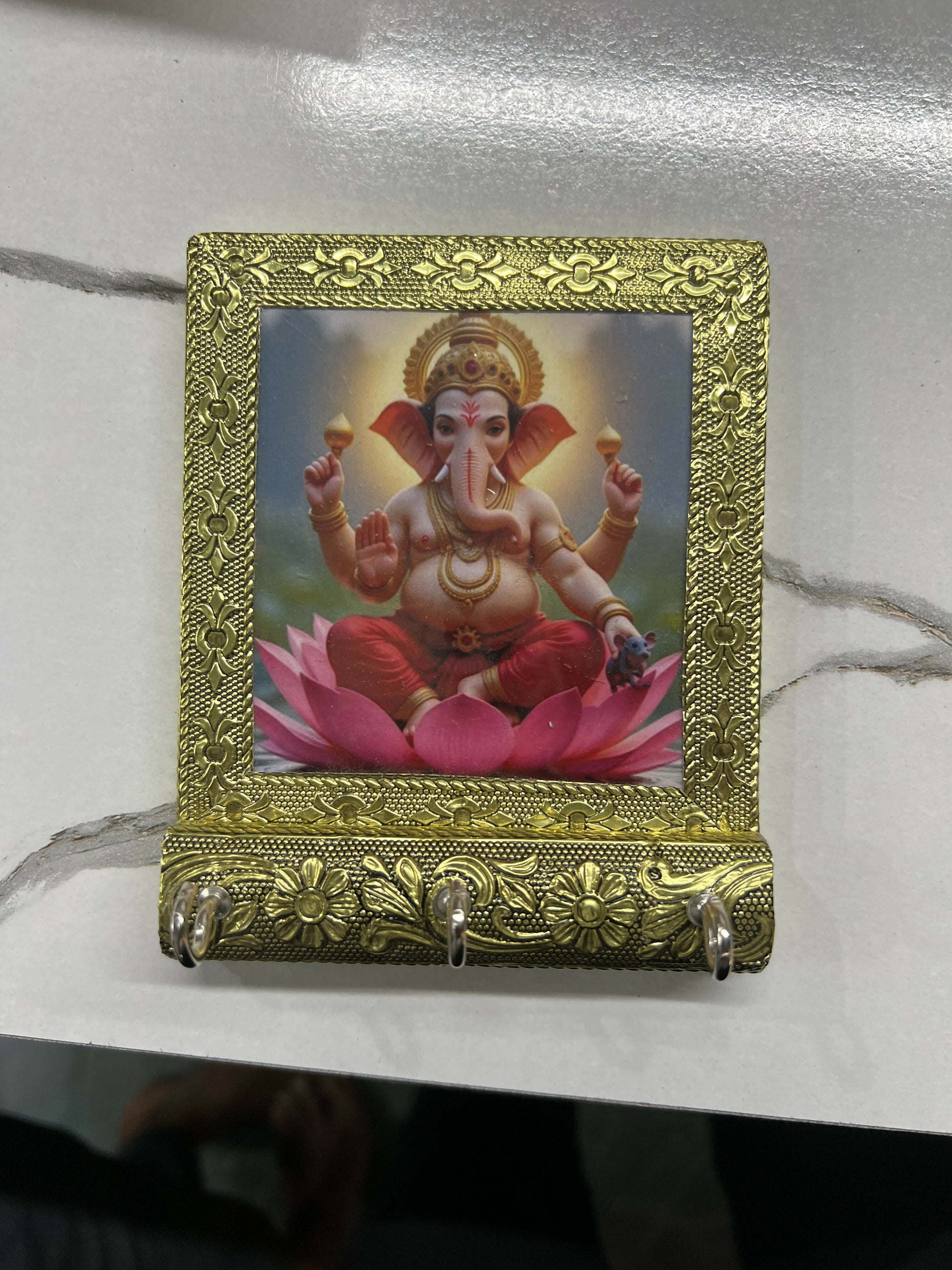 Decorative Lord Ganesha key holder with photo frame and three hooks mounted on wall
