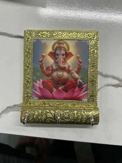 Decorative Lord Ganesha key holder with photo frame and three hooks mounted on wall