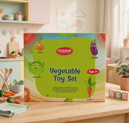 A green box with cartoon vegetables and text "Vegetable Toy Set" sits on a wooden table.