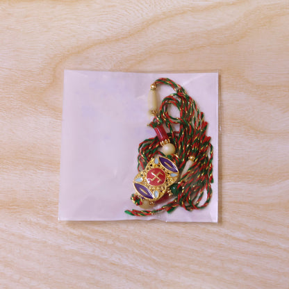 Festive Rakhi featuring Swastik Medallion and gold trims in display look for Gift Use