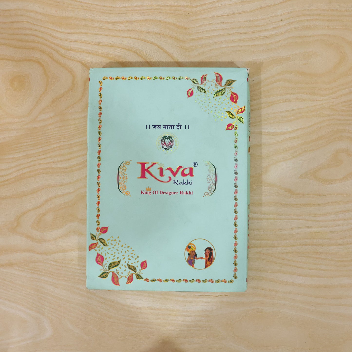 Silver Floral Stone Rakhi with Royal Blue Thread, Roli Chawal Coin and Card Gift Packing