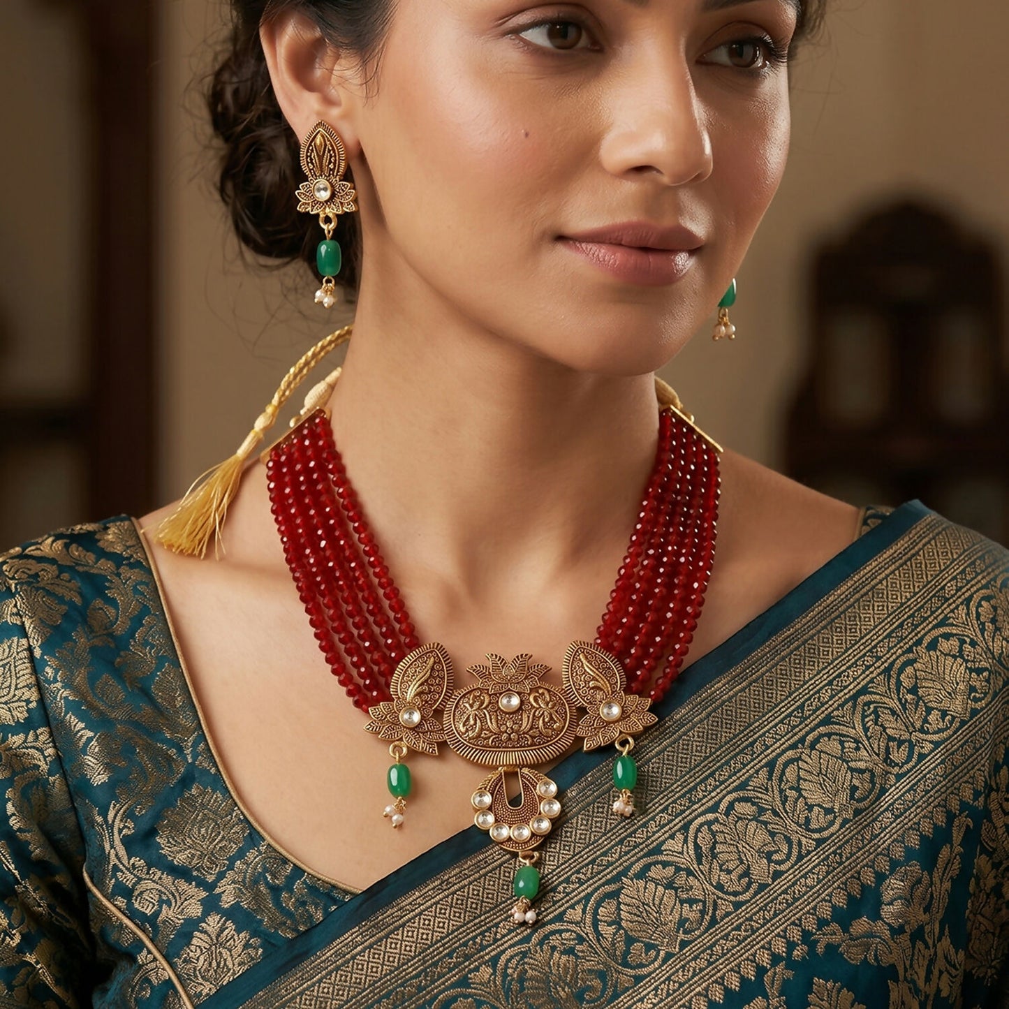 Close-up of maroon layered beads in necklace set