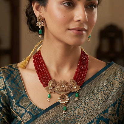 Close-up of maroon layered beads in necklace set
