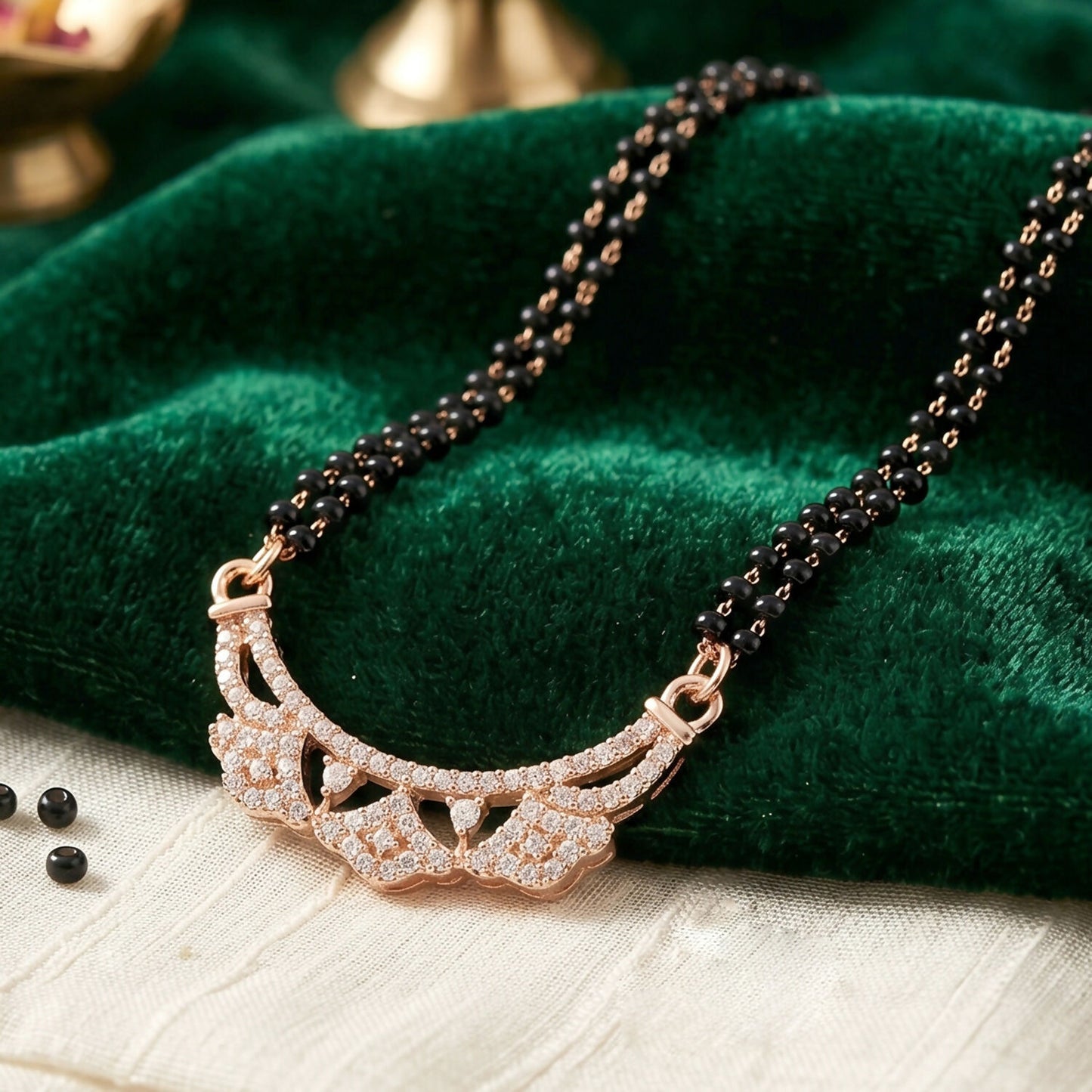 Stylish traditional mangalsutra styled with contemporary openwork floral pendant