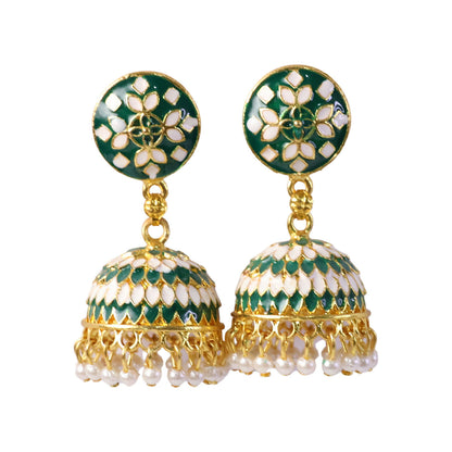Close-up of green jhumka earrings pearl drops