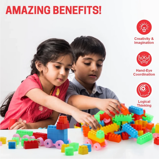 Two children playing with a large pile of colorful plastic building blocks, constructing small toy vehicles.