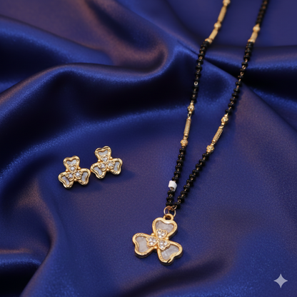Gold-plated AD floral mangalsutra necklace with black beads and clover stud earrings set