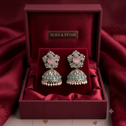 Traditional jhumka earrings with pink stones and turquoise beads angle view