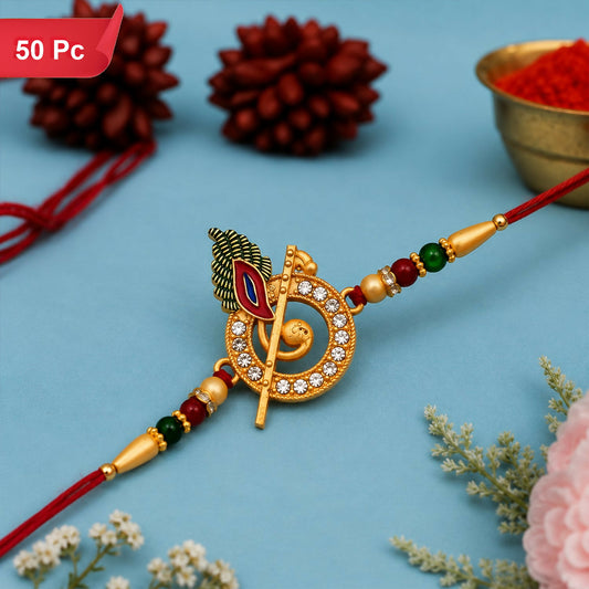 A red thread with a gold, circular charm featuring a flute, peacock feather, and white stones, on a blue background with red