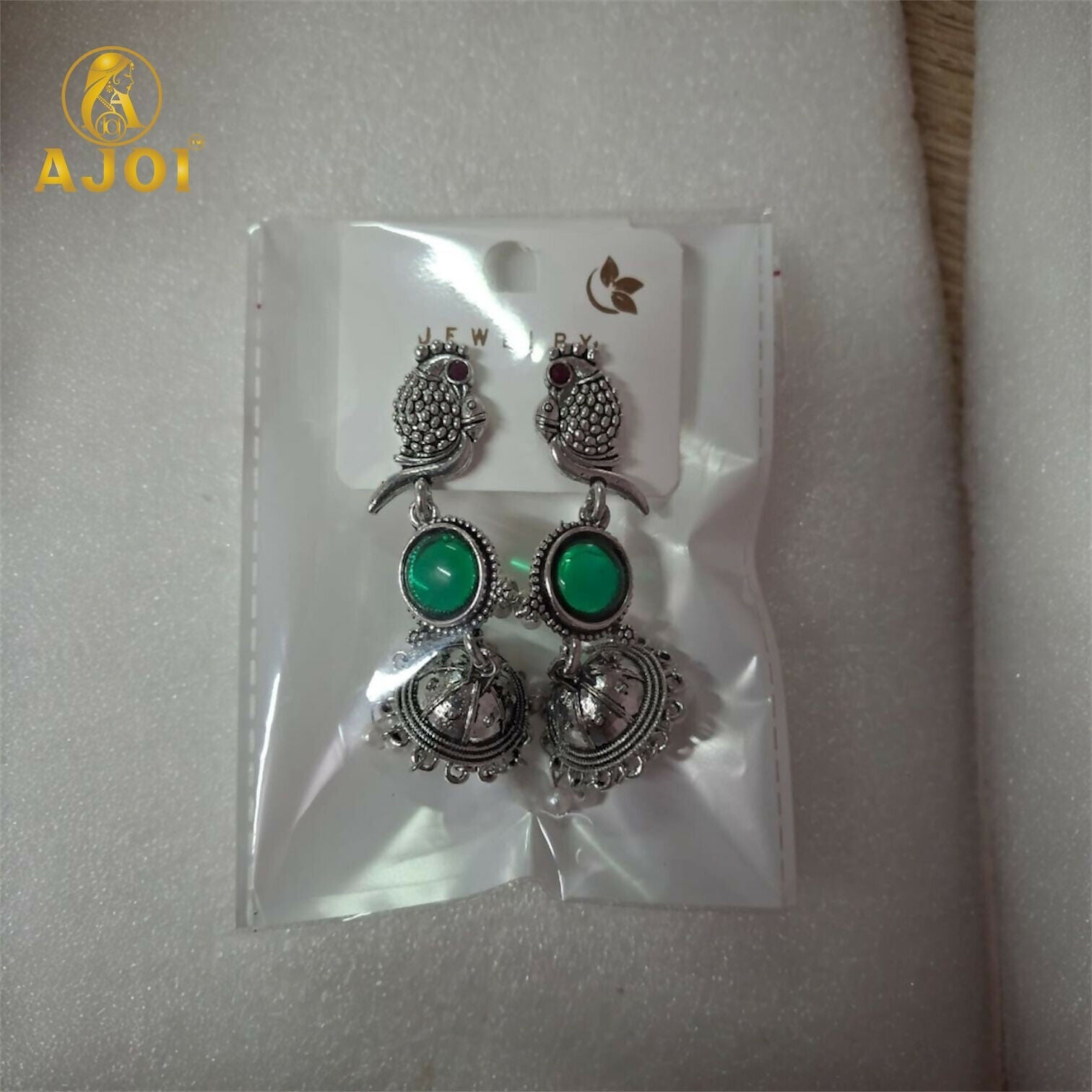 Pearl drop clusters on handcrafted antique silver peacock jhumka earrings