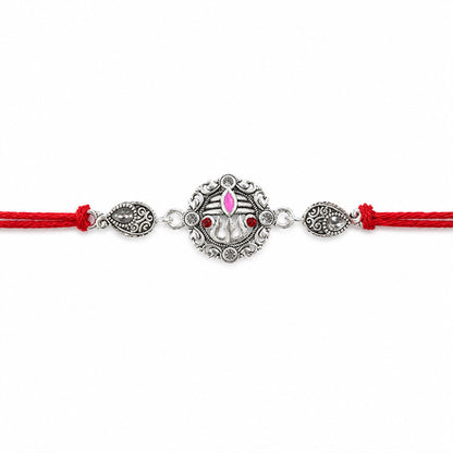 Premium Rakhi showcasing Silver Om Leaf Charm, gold trims and chain look for Gift