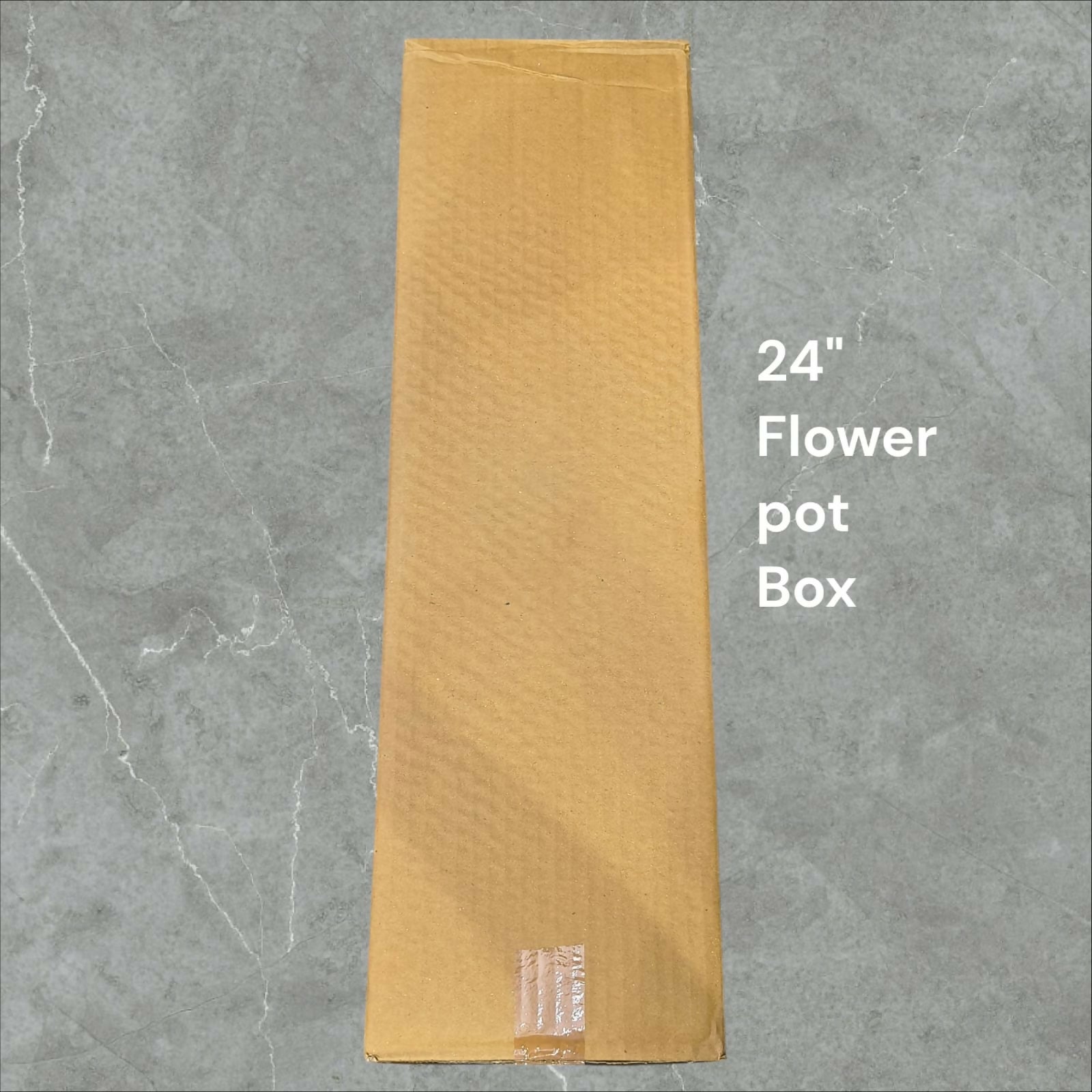 Large handcrafted metal flower vase on floor
