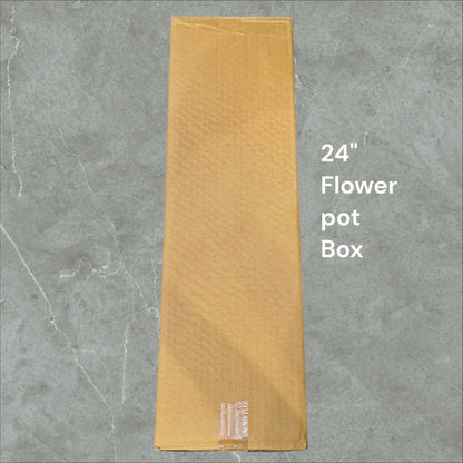 Large handcrafted metal flower vase on floor