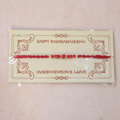 White Thread Rakhi with Smooth Red Oval Bead Accents
