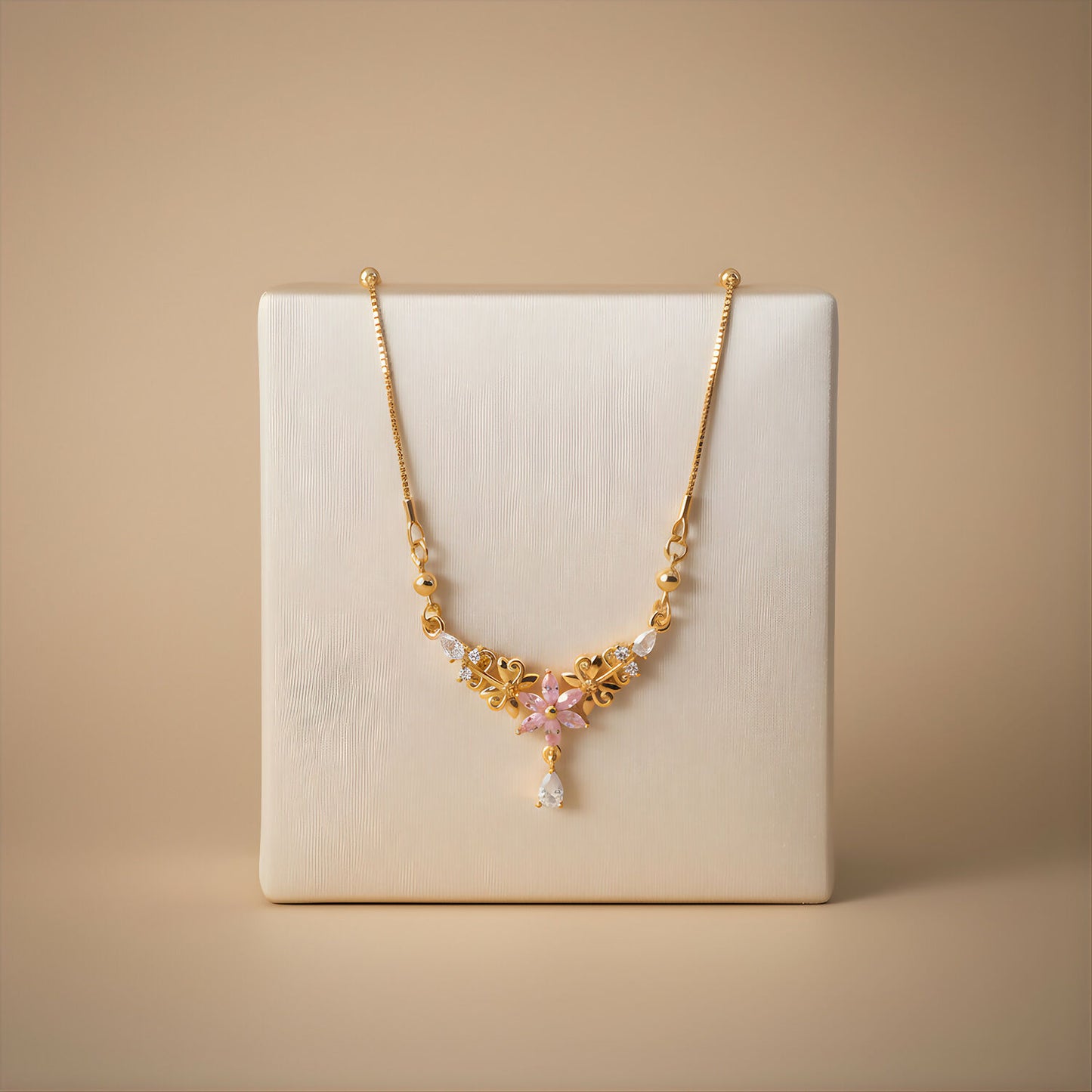 Elegant gold finish pink floral pendant necklace styled for festive occasions