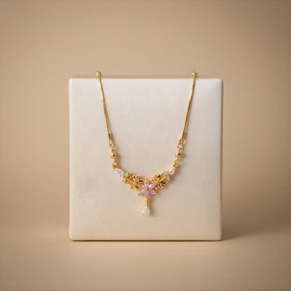 Elegant gold finish pink floral pendant necklace styled for festive occasions