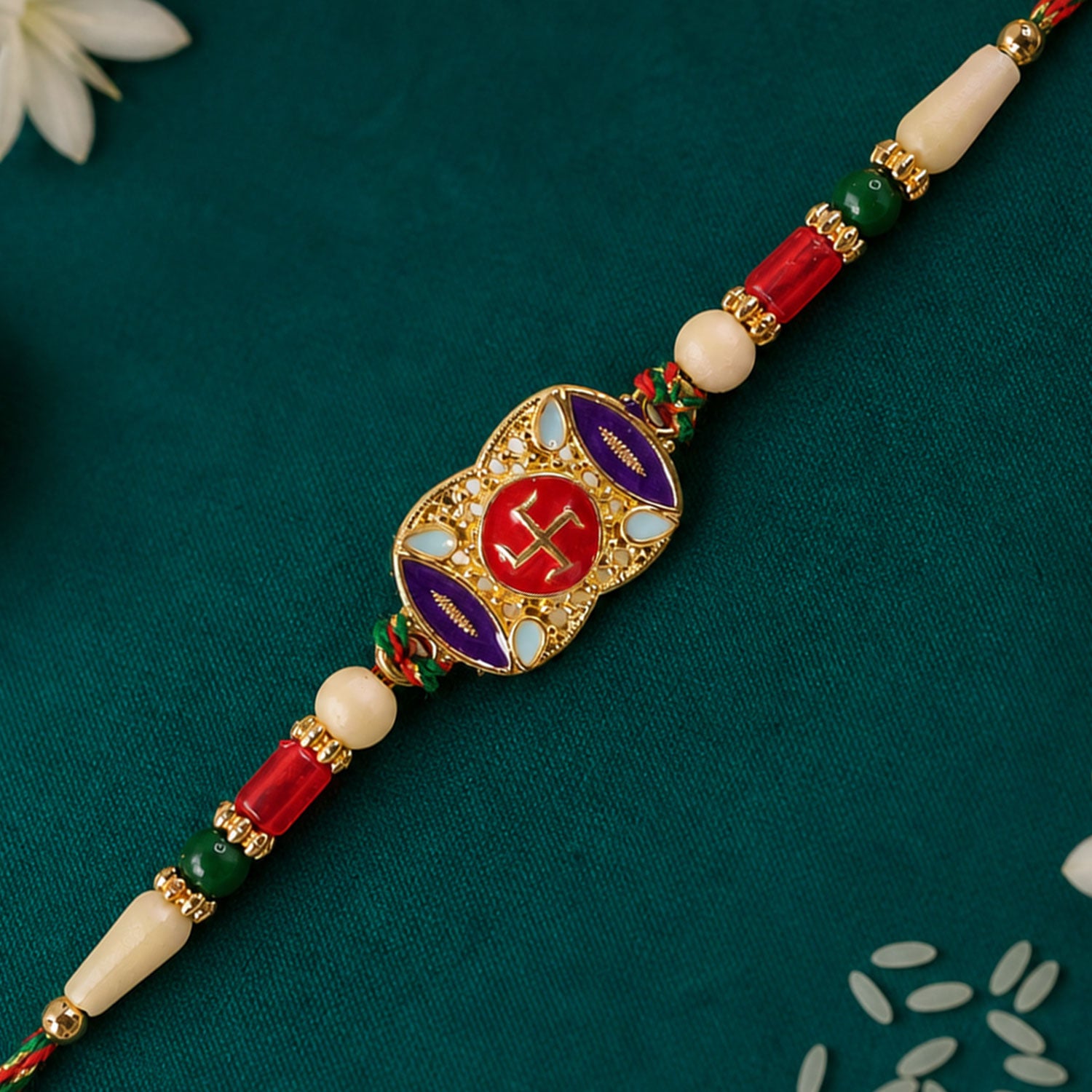 Festive Rakhi featuring Swastik Medallion and gold trims in display look for Gift Use