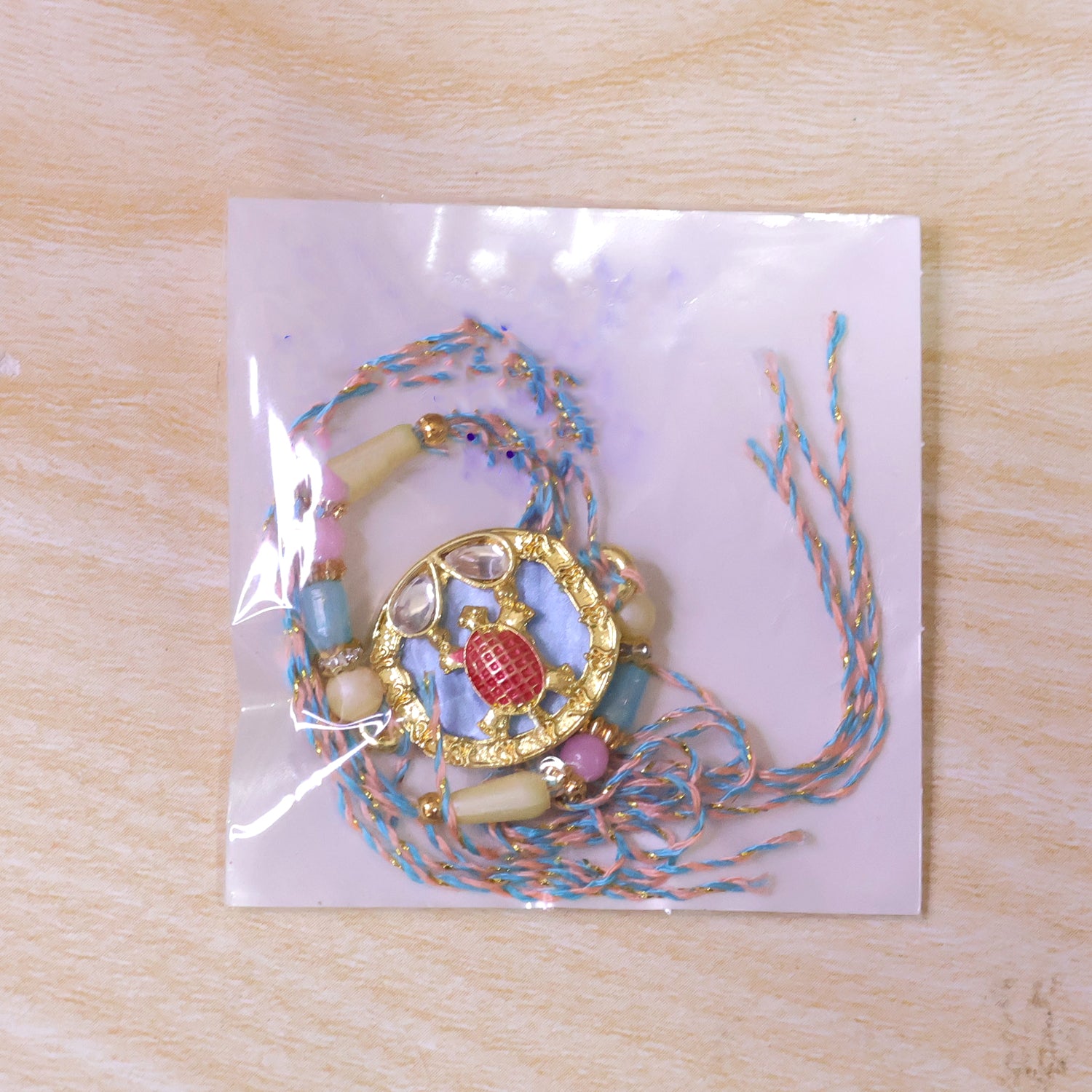 Elegant Blue Designer Rakhi for Brother with Golden Pendant & Premium Bead Work