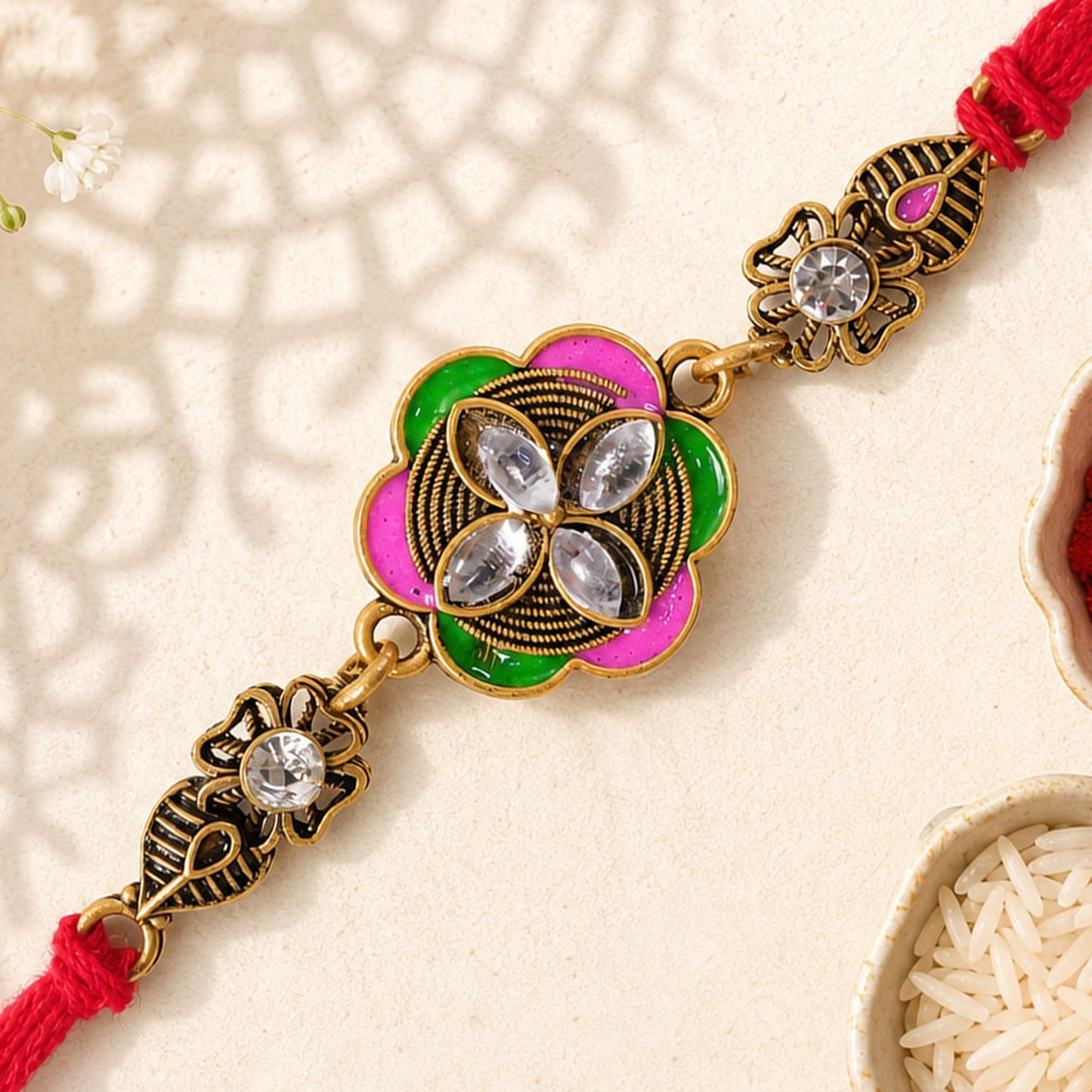 Ornate Rakhi with Floral Medallion, multicolor stones and chain look for Gifting