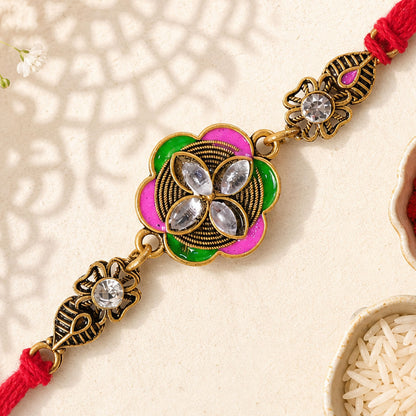 Ornate Rakhi with Floral Medallion, multicolor stones and chain look for Gifting