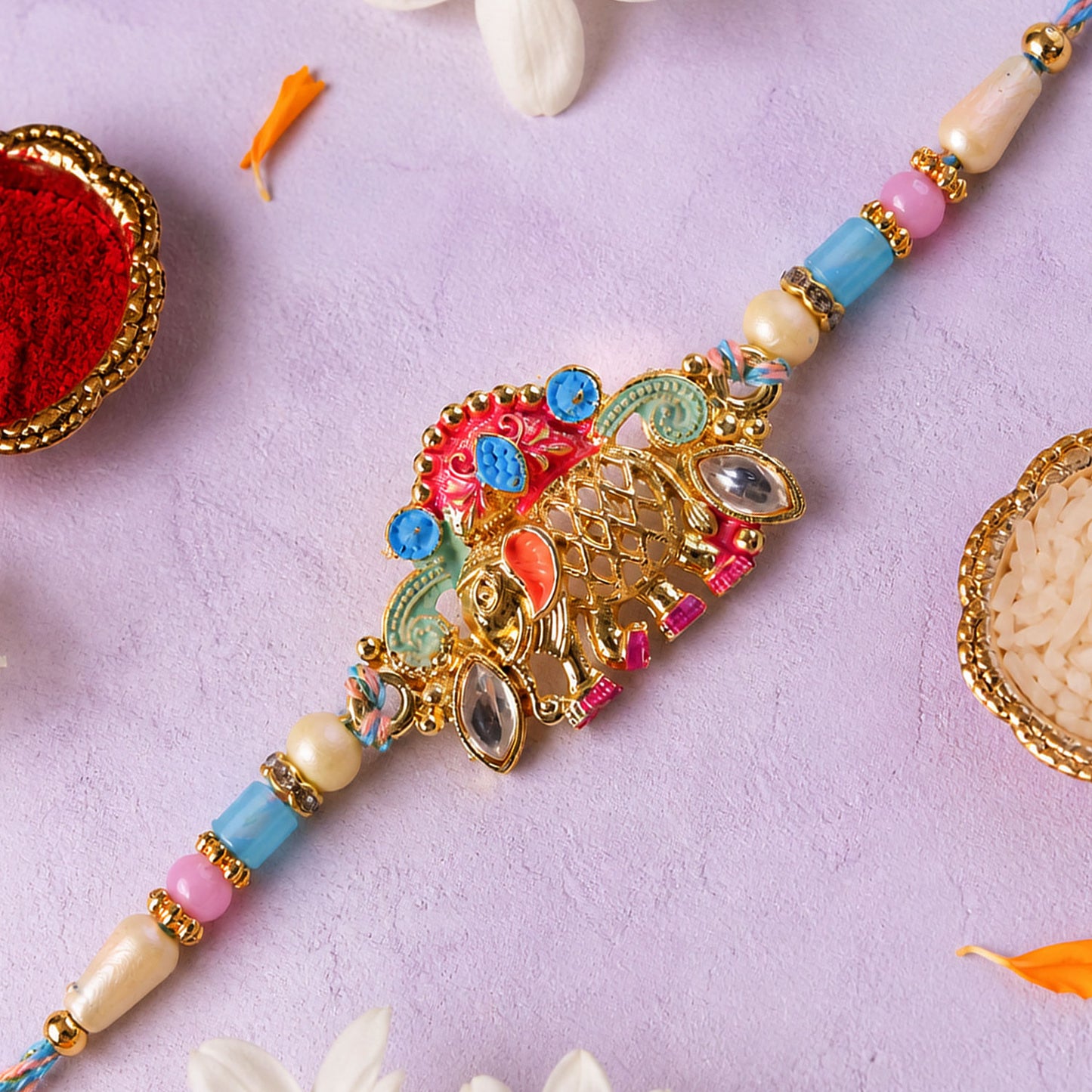Textured Gold Elephant Pendant Rakhi with Multicolor Kundan