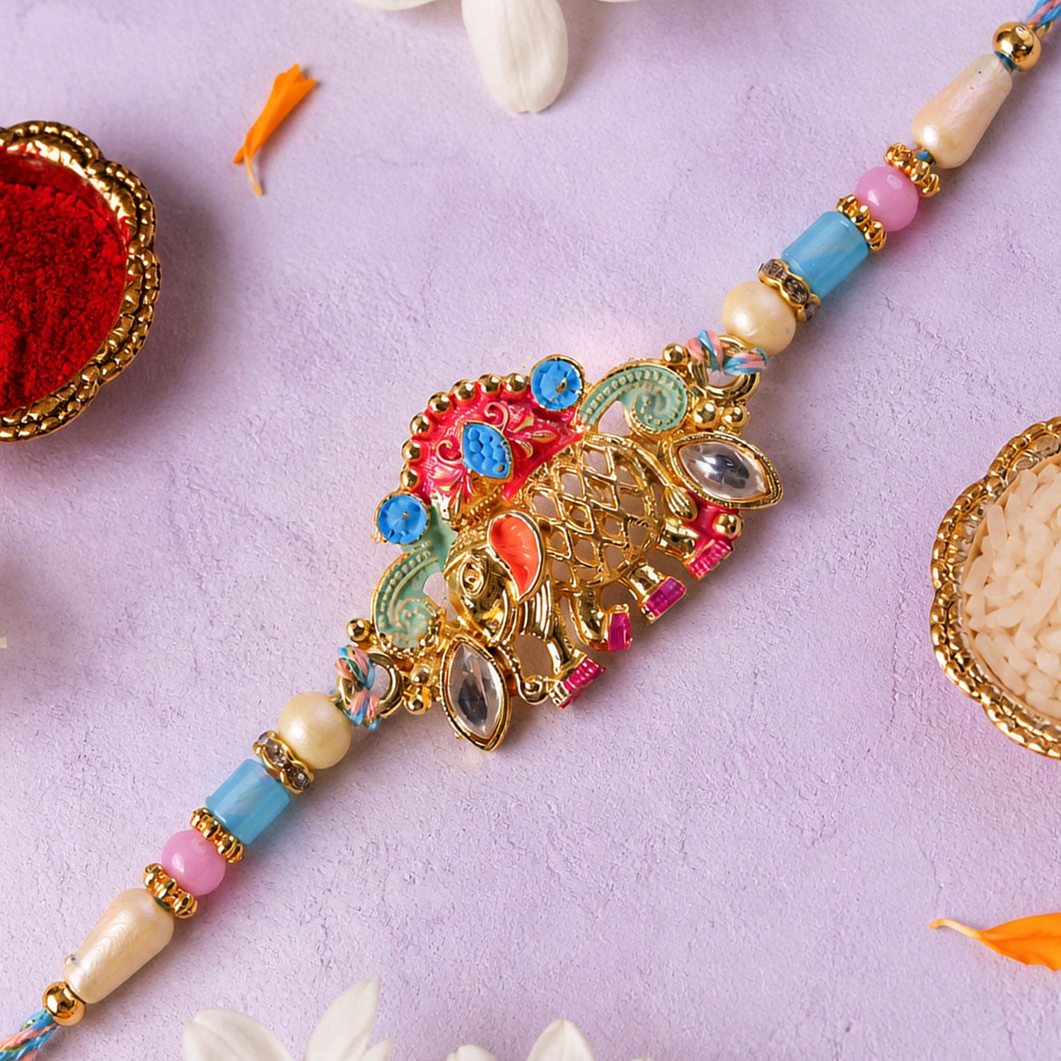 Textured Gold Elephant Pendant Rakhi with Multicolor Kundan