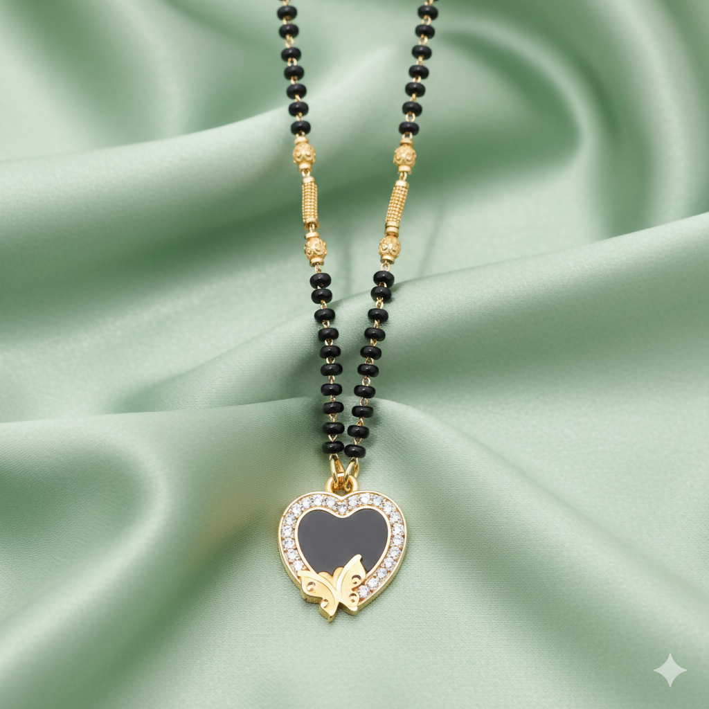 Gold-plated Mangal Sutra with heart-shaped pendant and black enamel butterfly motif