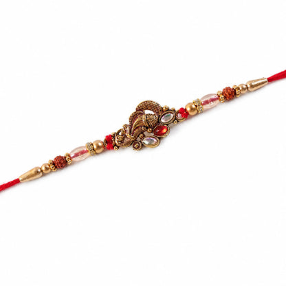 Elegant Rakhi with Ornate Floral Medallion and metal trims in chain look for Gift Use