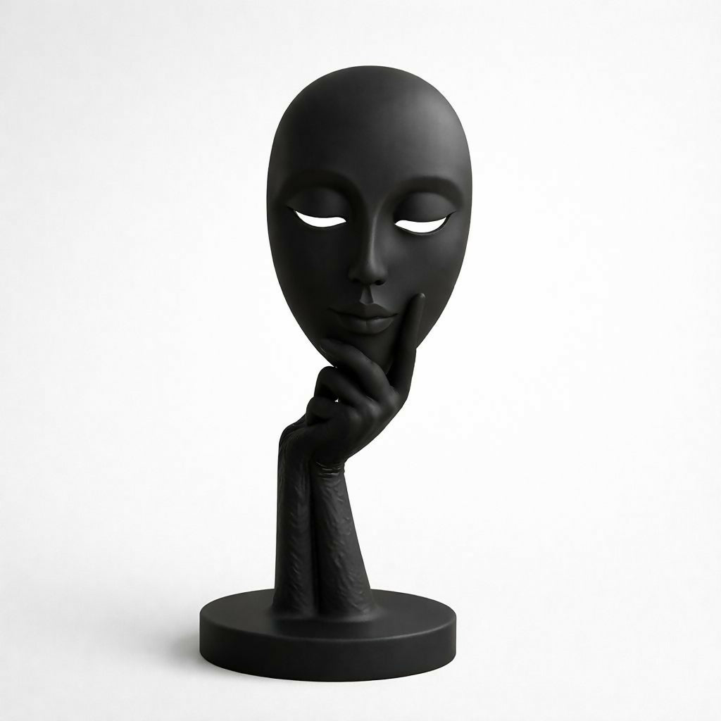 Abstract face statue placed on office desk for décor