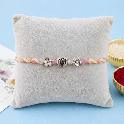 Graceful Pastel Bracelet Rakhi with Silver Centre and Delicate Raksha Bandhan Beauty